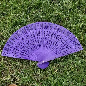 Elegant purple hollow-out carved wooden folding fan for weddings or stage dance decor