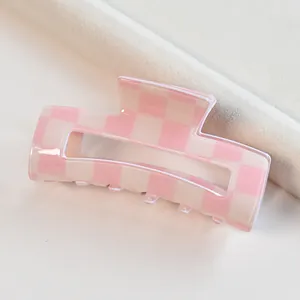 Pink and white checkered square hair claw clip, elegant checkerboard shark clip accessory.