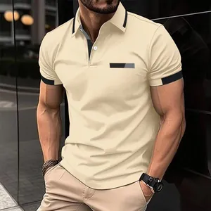 Close-up detail of a men's beige slim fit polo shirt with a stylish faux pocket print.