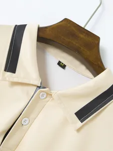 Detailed close-up of a men's polo shirt collar with black stripe accents.