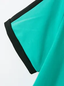 Detail view of men's cotton twill Polo shirt sleeve featuring black contrast trim