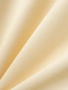 Detailed macro shot of soft cream breathable knitted fabric for men's Polo shirt