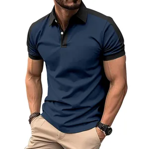 Detail view of a stylish men's color-block twill cotton polo shirt in navy blue and black