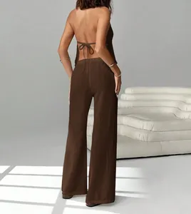Back view of a brown backless halter top and wide-leg trousers matching set for women.