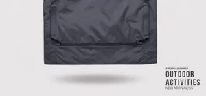 Close-up detail of the grey multi-pocket outdoor vest featuring functional zippers
