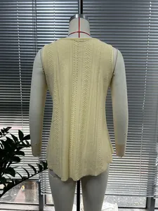 Detailed back view of a yellow sleeveless eyelet knit t-shirt on a mannequin torso