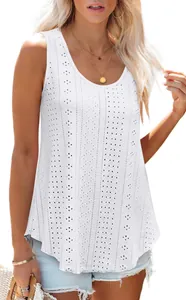 Detail of white sleeveless tank top with round neck and intricate eyelet embroidery