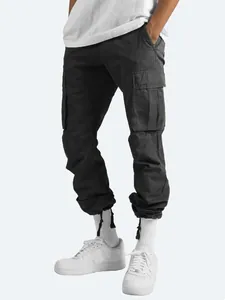Detailed view of black men's cargo pants with adjustable drawstring cuffs and side pockets.
