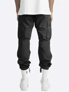 Back view of men's black cargo pants featuring drawstring hems and multi-pocket design