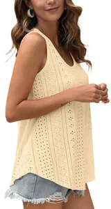 Close-up of beige sleeveless top with eyelet embroidery and loose round neck design