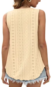 Detailed back view of a sleeveless beige eyelet embroidered top with a loose round neck