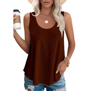 Detailed view of a woman wearing a brown eyelet lace sleeveless tank top holding a coffee cup