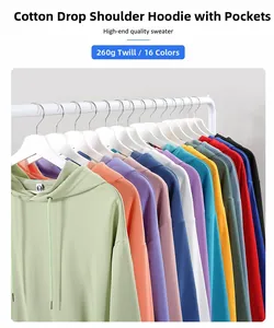 Detail view of 260g oversized hooded sweaters in multiple vibrant colors on a rack