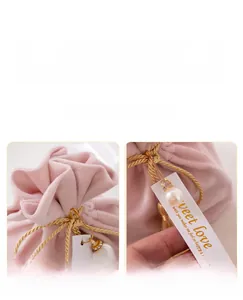 Detailed macro view of elegant pink velvet wedding drawstring candy gift bag with pearl tag