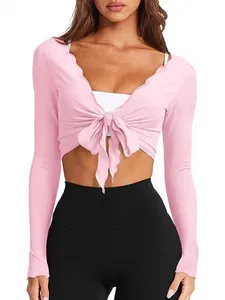 Top corto de punto rosa ajustado con cuello en V y lazo frontal de mangas largas
