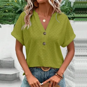 Detailed view of women's casual V-neck T-shirt with green eyelet fabric and buttons