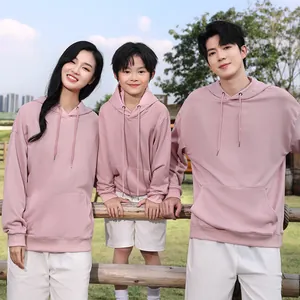 Matching family pink oversized hoodies for men women and kids in soft outdoor setting