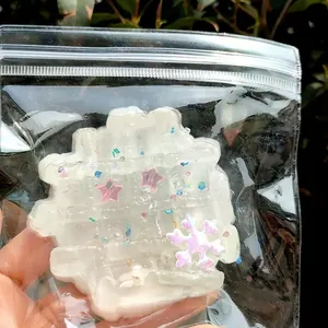 Süßes weißes Deko-Quetschspielzeug zur Entspannung mit Sternen und Schneeflocke im Beutel