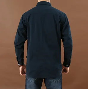 Back view of a men's navy blue long sleeve casual shirt with durable workwear styling
