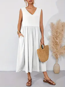 Detail of sleeveless white V-neck maxi dress featuring functional side pockets