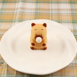 Detail view of cute capybara squishy toy popping a bubble, perfect for stress relief
