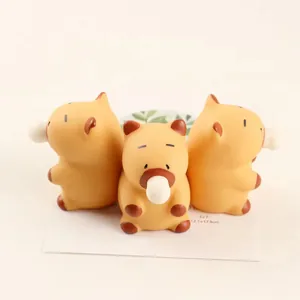 Close-up of three cute Capybara squishy toys with bubble details for stress relief.