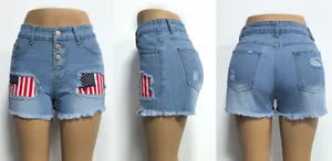 Distressed light blue denim shorts for women with American flag patches and tassel hem detail