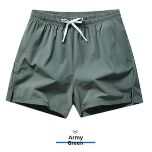Detail of army green quick-dry sports shorts with white drawstring waist for men
