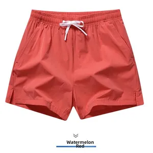 Watermelon red quick-dry sports shorts for men featuring a comfortable elastic drawstring waist