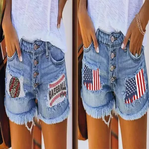 Detailed view of frayed denim shorts featuring baseball and US flag printed patches.