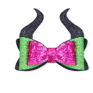 Halloween pet hair clip featuring glittery Maleficent horns and layered pink bow