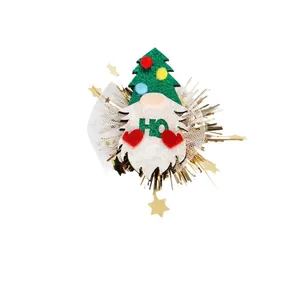 Christmas pet hair clip with glittery gnome design and green festive tree hat decoration