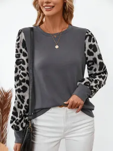 Fashionable grey round neck long sleeve top featuring stylish leopard print puff sleeves for women