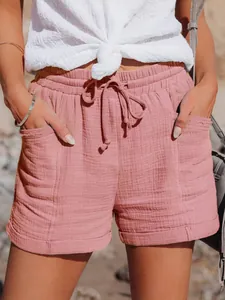 Pantaloncini rosa a vita alta con coulisse, gamba larga e comode tasche laterali