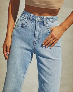 Detail view of high-waisted vintage wash straight leg denim jeans for women