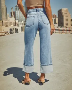 Detailed back view of high-waisted light blue straight jeans with cuffed hem