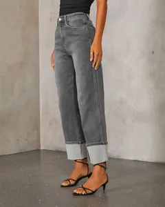 Side view of grey high-waisted straight jeans with stylish retro cuffed hems