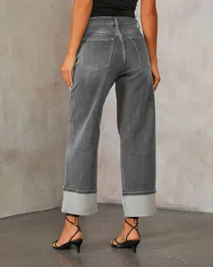 Back view of grey high-waisted straight jeans with stylish wide rolled cuffs.