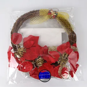 Close-up detail of the Christmas wreath on a scale weighing approximately 113.3 grams.