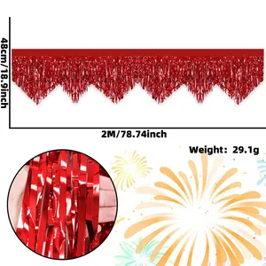 Close-up detail of shiny red wavy tinsel fringe curtain for Christmas party decoration