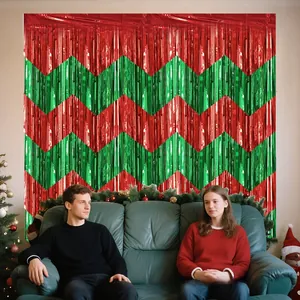 Festive red and green zigzag foil fringe backdrop for Christmas party decorations.