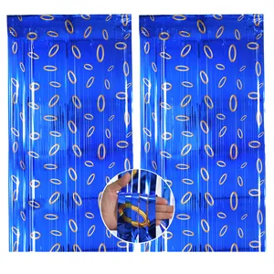 Blue foil fringe curtain with Sonic gold ring patterns for kids birthday party backdrop