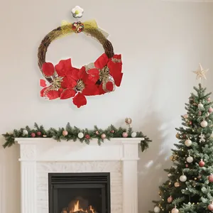 Traditional festive Christmas wreath with red poinsettia flowers and golden bow decoration