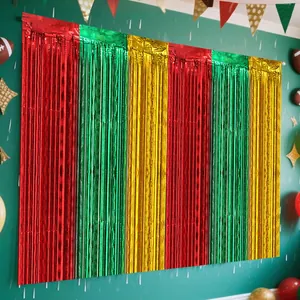 Red green and gold metallic tinsel curtain backdrop for Christmas party decoration details