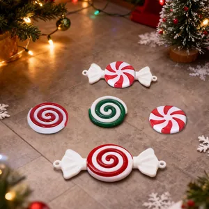 Assortment of red and white spiral peppermint candy ornaments for Christmas tree decoration.