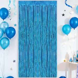 Metallic blue foil fringe curtain backdrop with balloons for birthday party decor