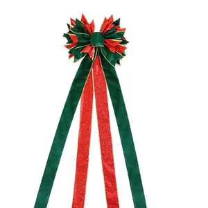 Grand nœud de sommet de sapin de Noël avec rubans à paillettes rouges et velours vert.
