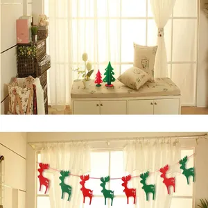 Christmas reindeer felt bunting garland and decorative trees in cozy home setting