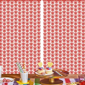 Detailed view of red butterfly cutout foil curtain backdrop for party decoration.
