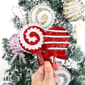 Decorazioni natalizie lecca-lecca rossi glitterati per albero.